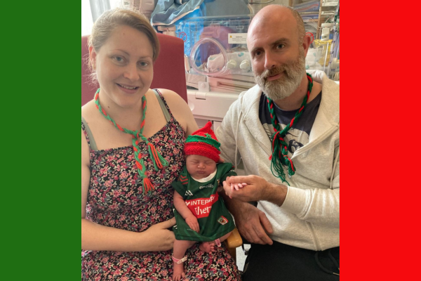 Pictured are proud parents Cecelia and Damian Birrane, from Ballina, Co. Mayo, with their newborn daughter, Eve Samantha, wearing a Mayo jersey.